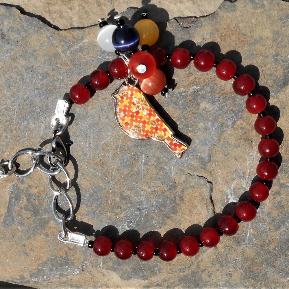 Handmade jewelry set: bracelet and earrings with enameled silver charms